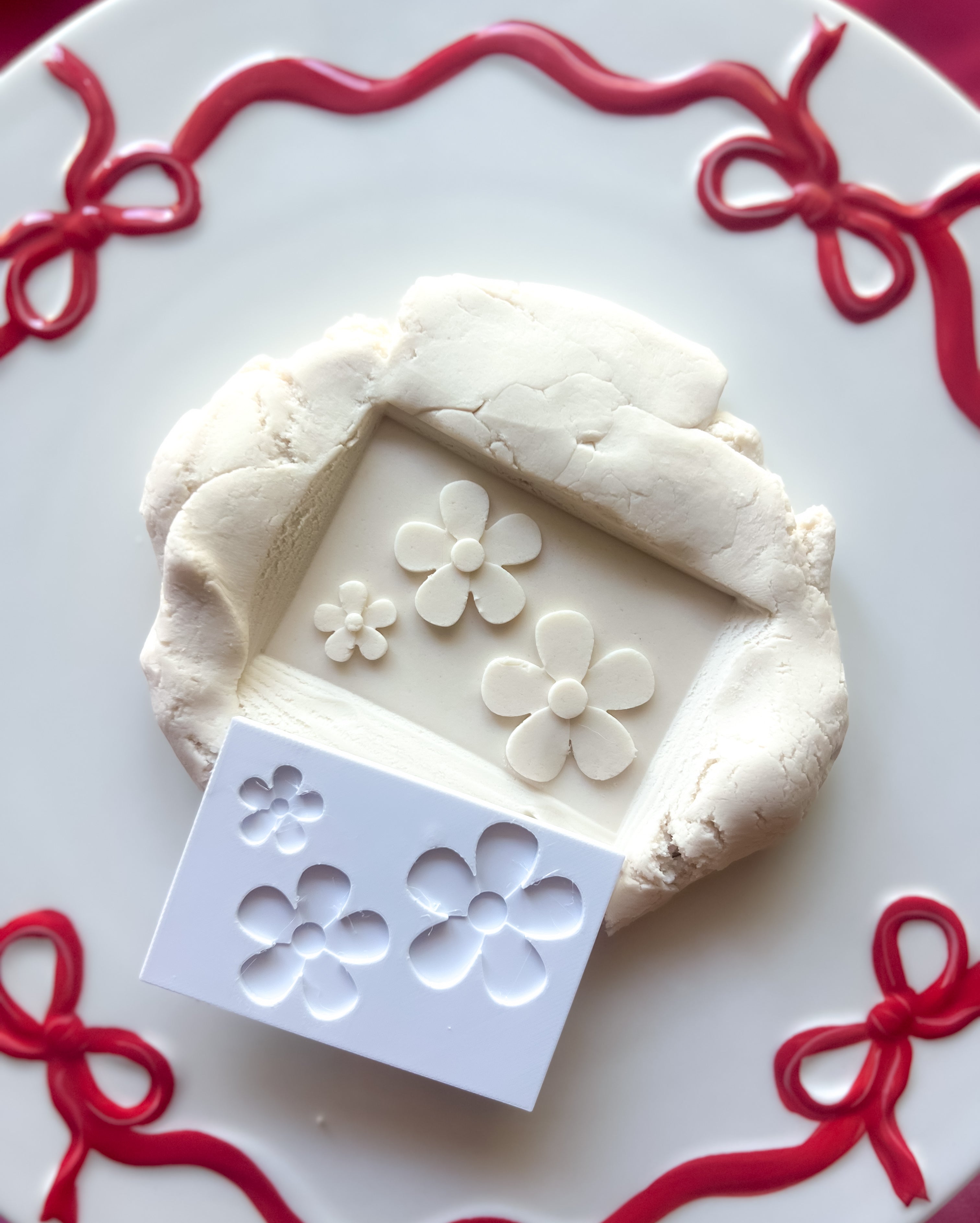 Daisy plate debosser