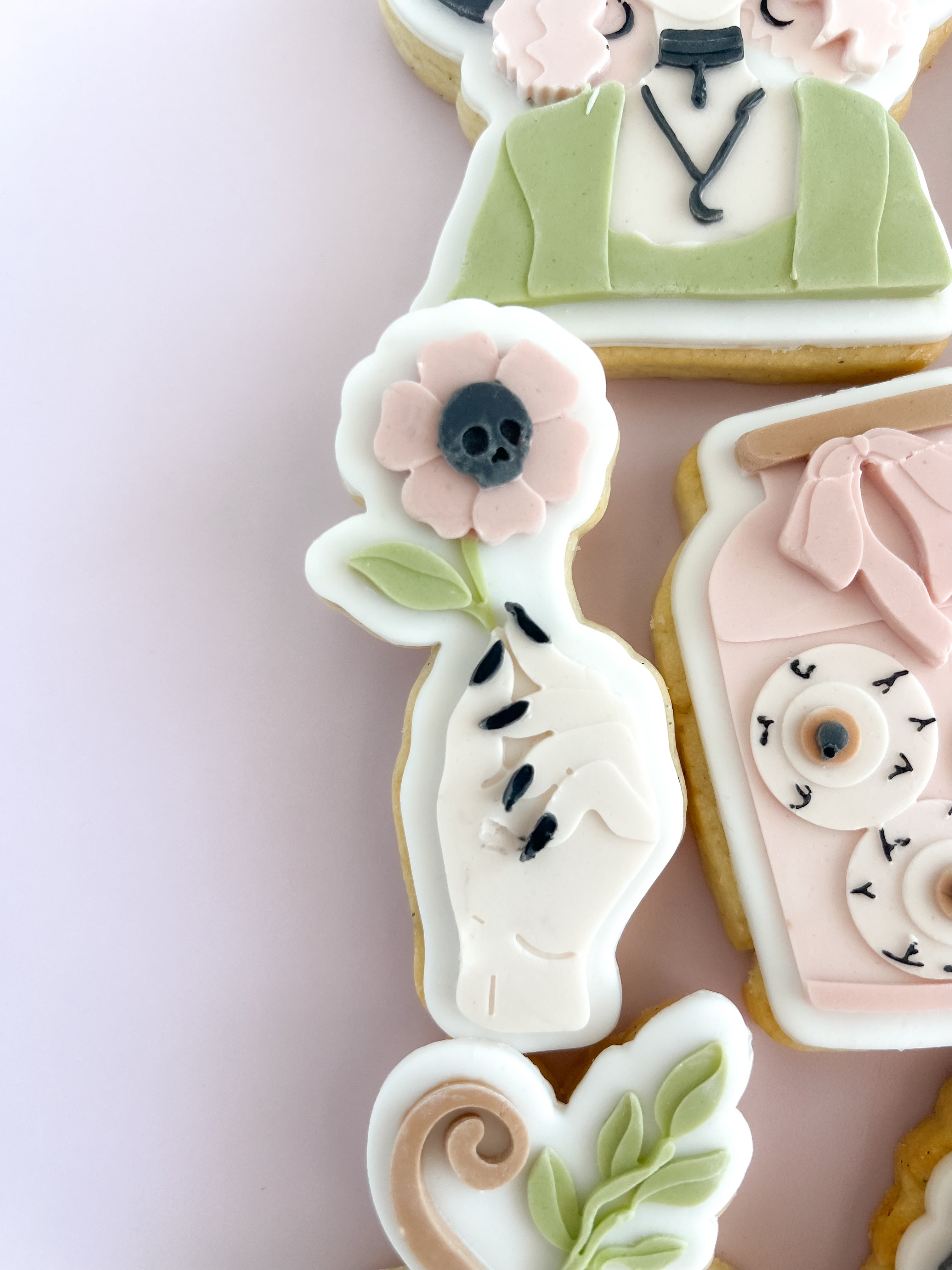 Hand holding skull flower debosser and cutter