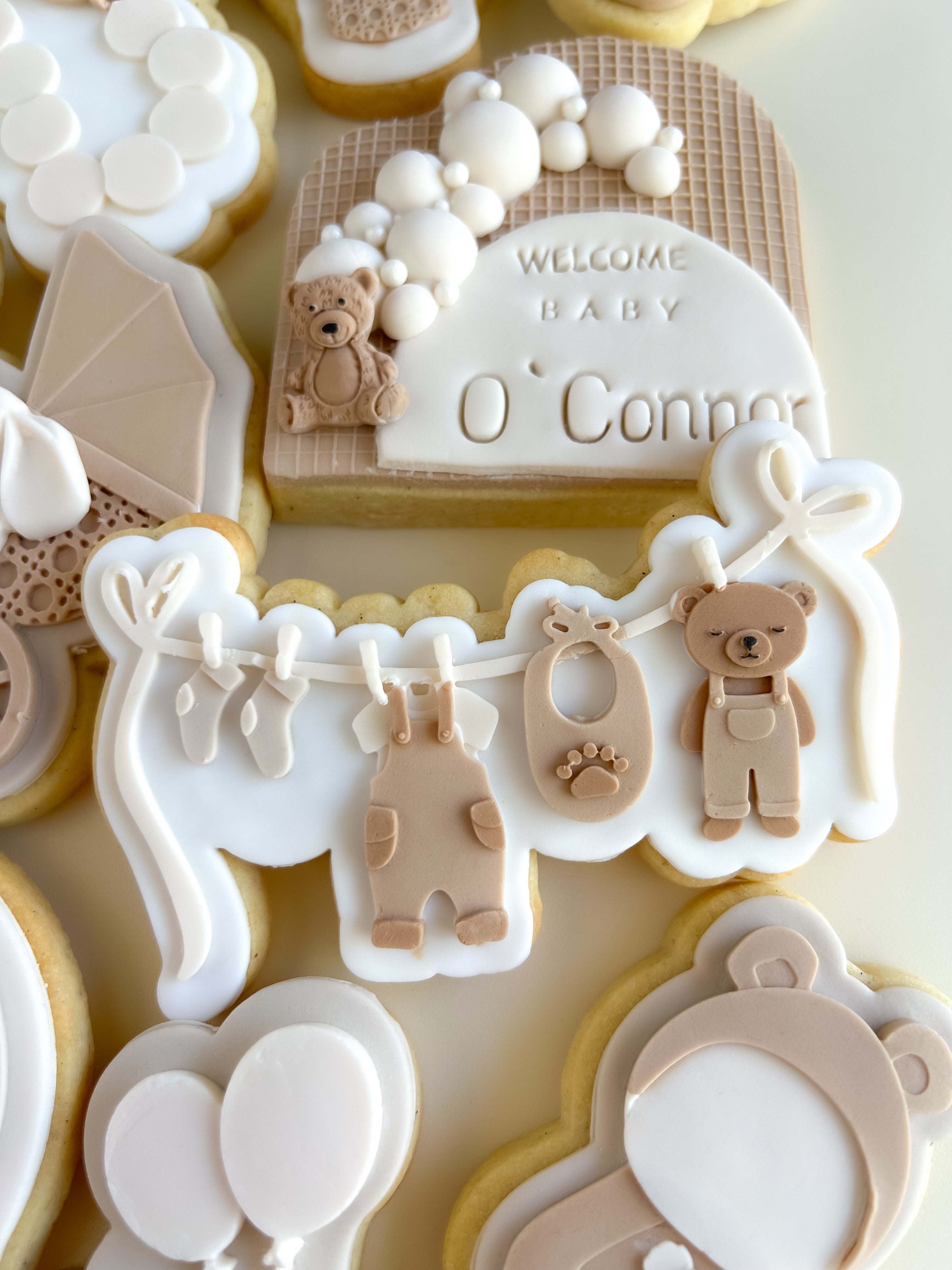 Bear and baby items on clothesline debosser and cutter