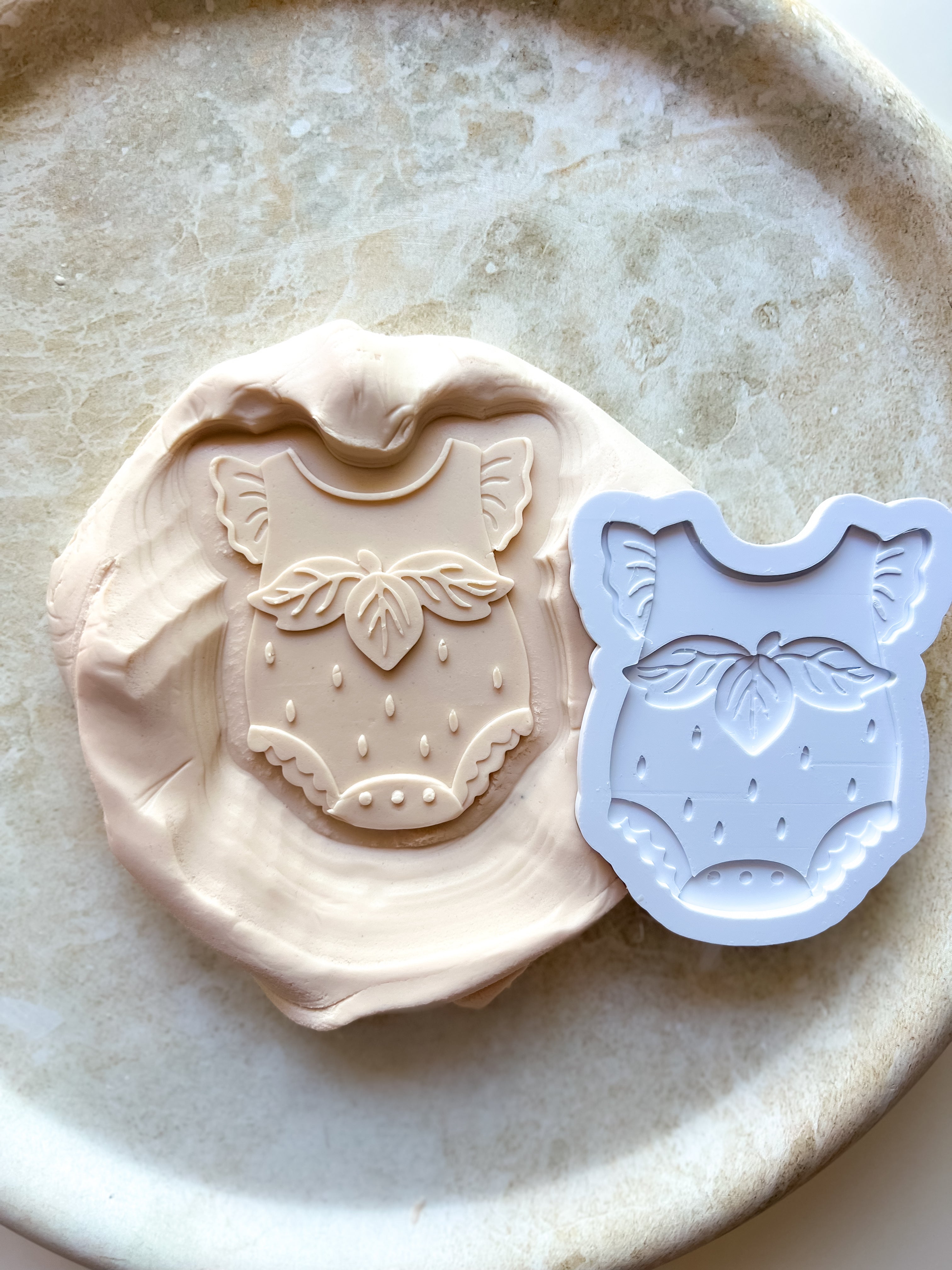 Strawberry baby onesie debosser and cutter