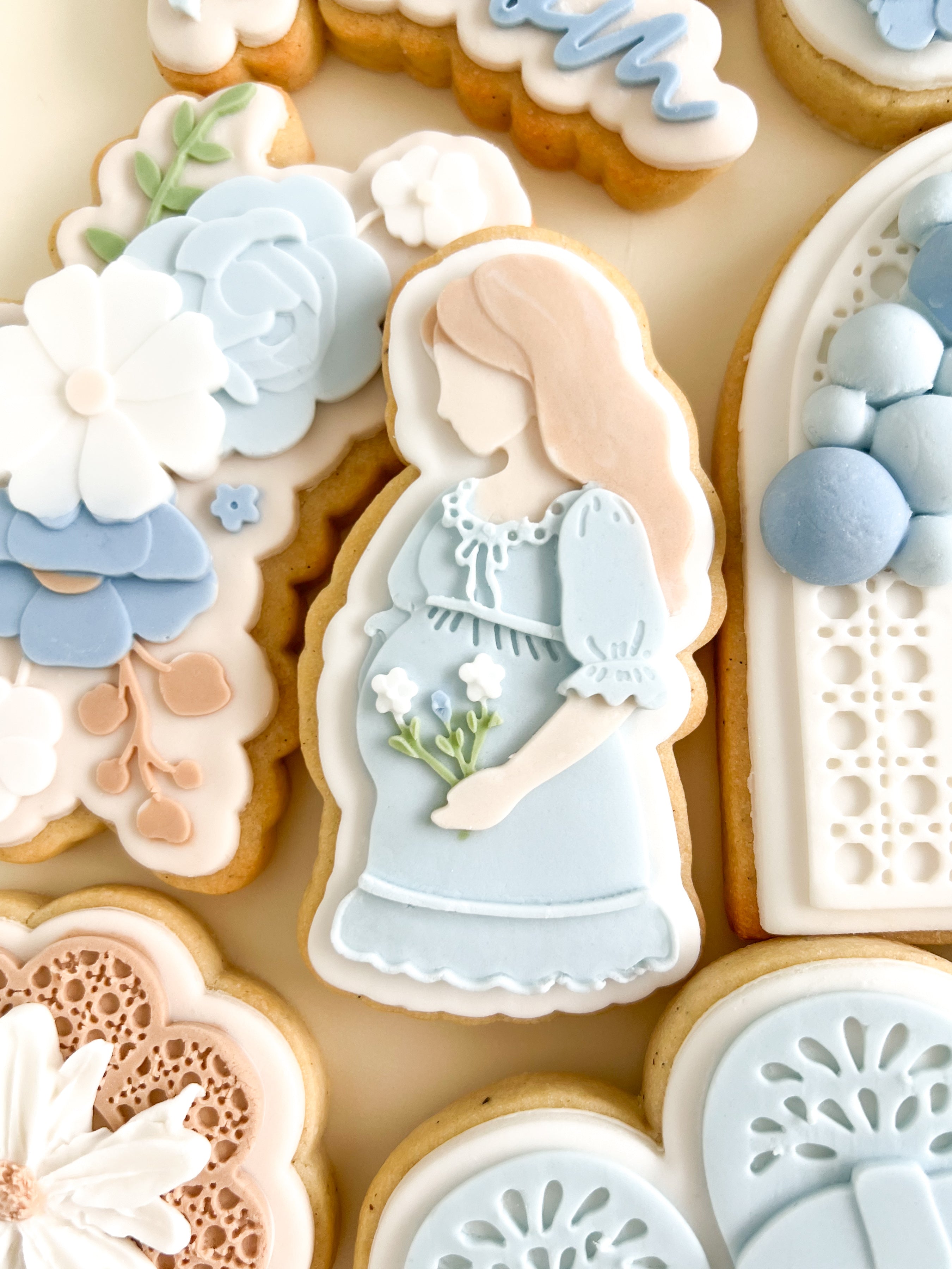 Pregnant mother with florals debosser and cutter