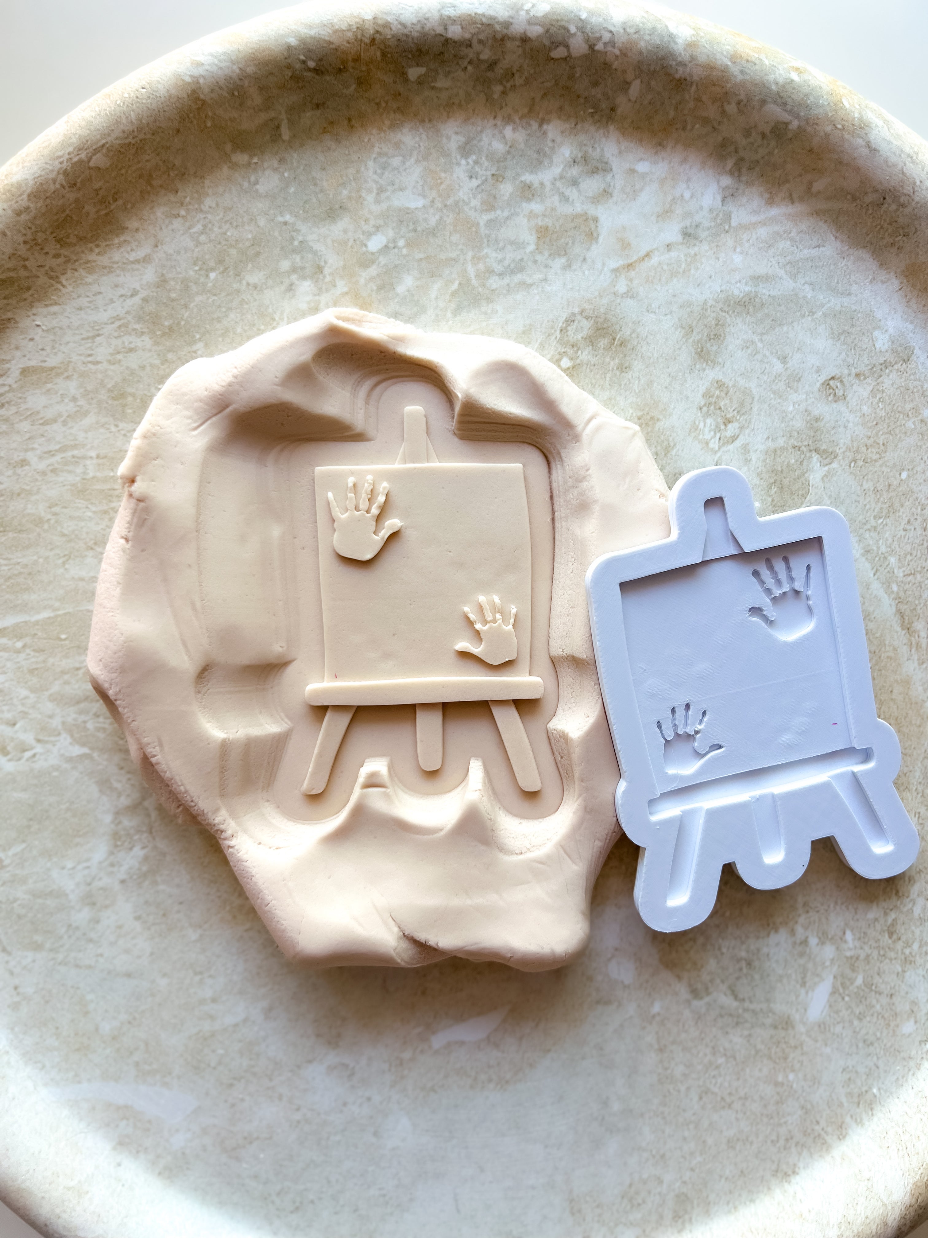 Easel with handprints debosser and cutter