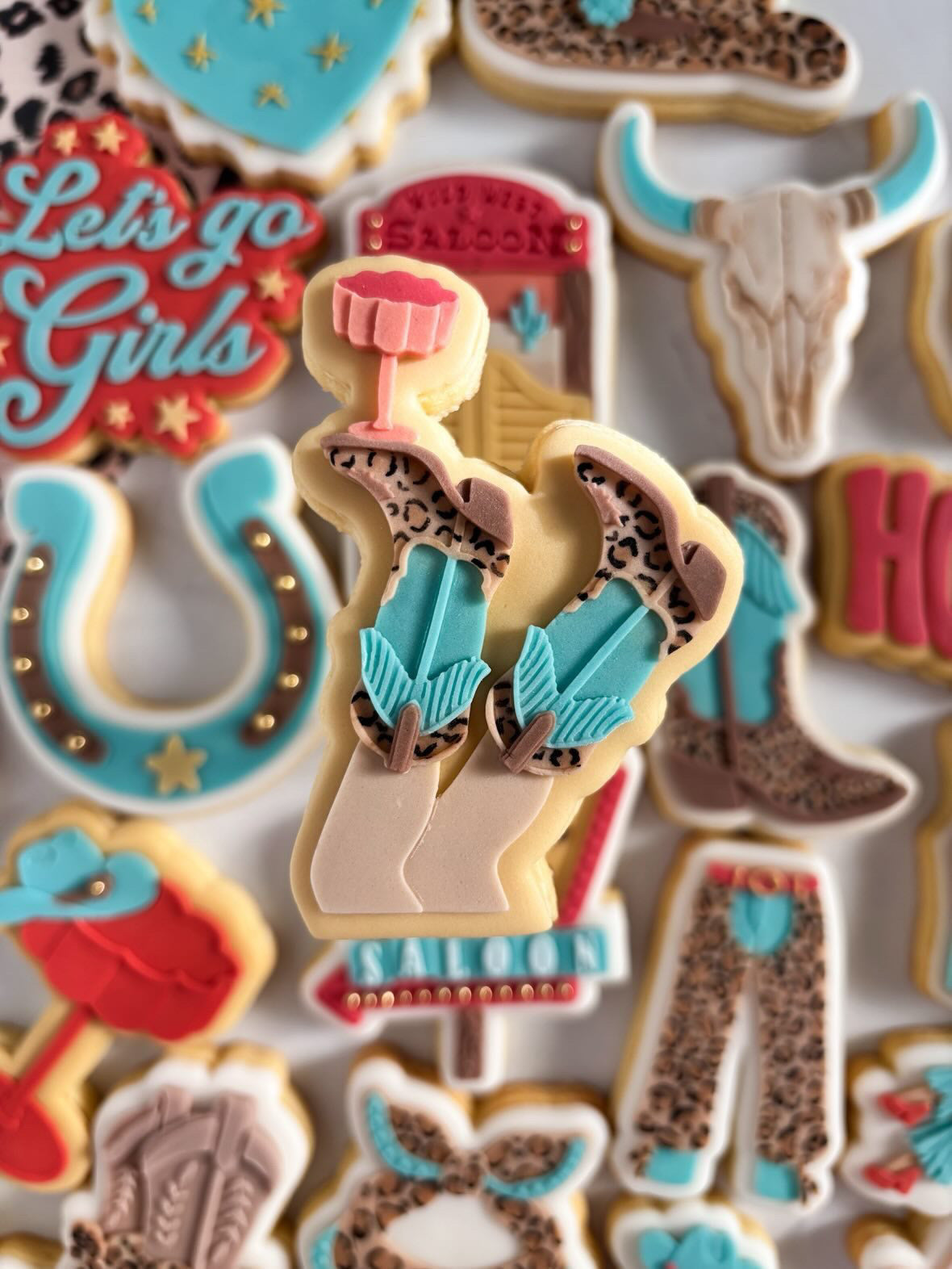 Cowgirl boots with cocktail glass debosser and cutter