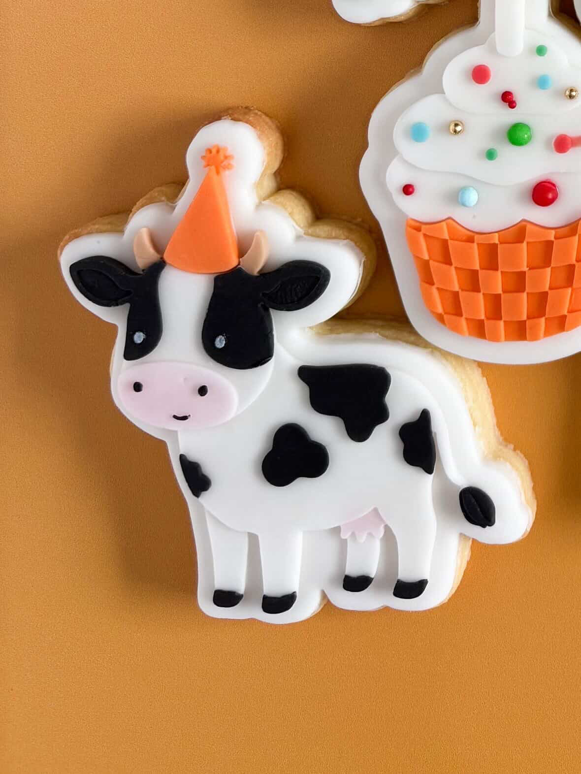 Cow wearing party hat debosser and cutter