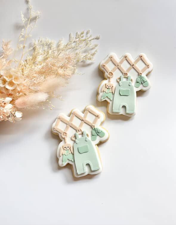 Baby and toy bunny on flat bassinet debosser and cutter