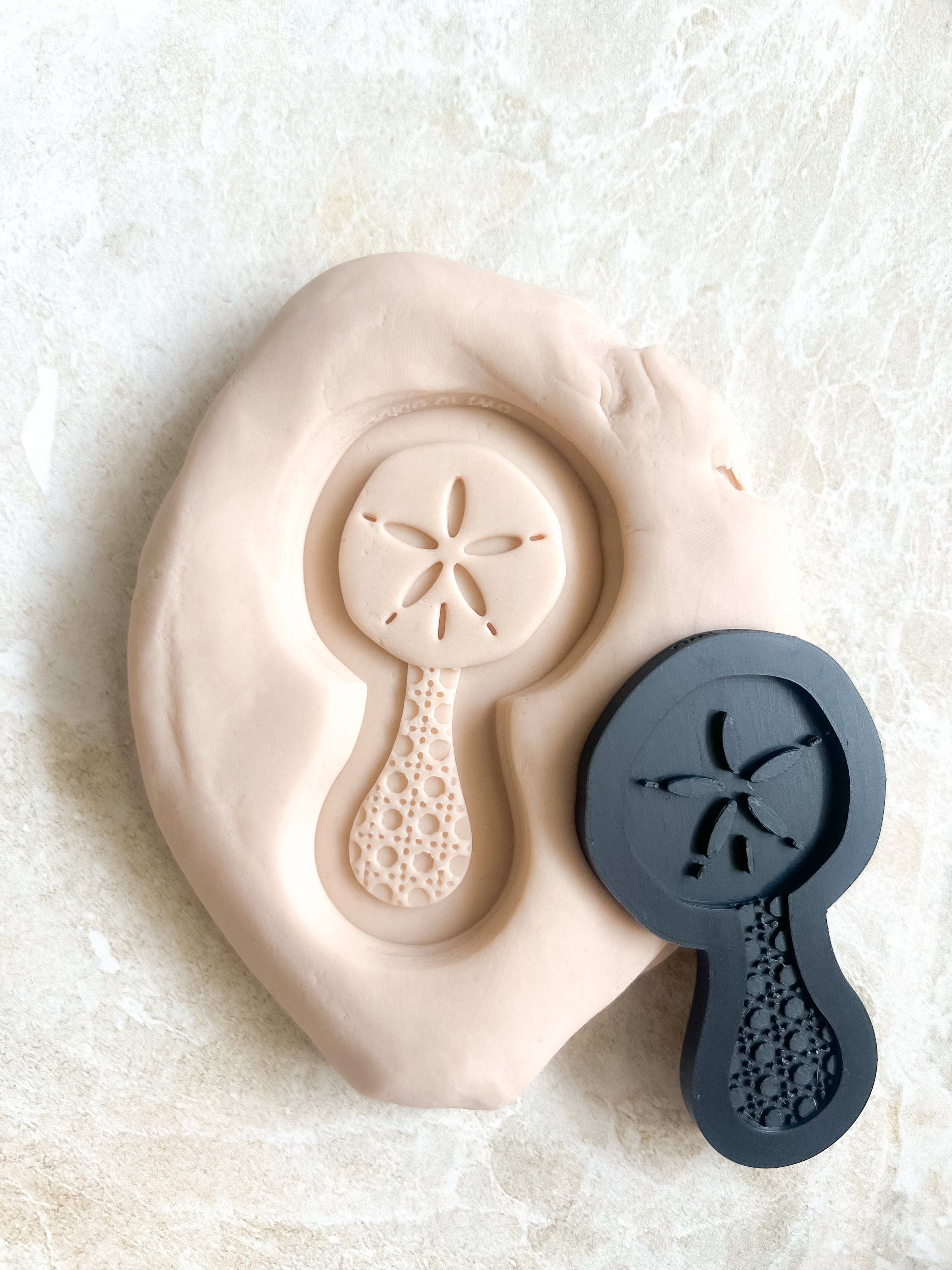 Sand dollar baby rattle debosser and cutter