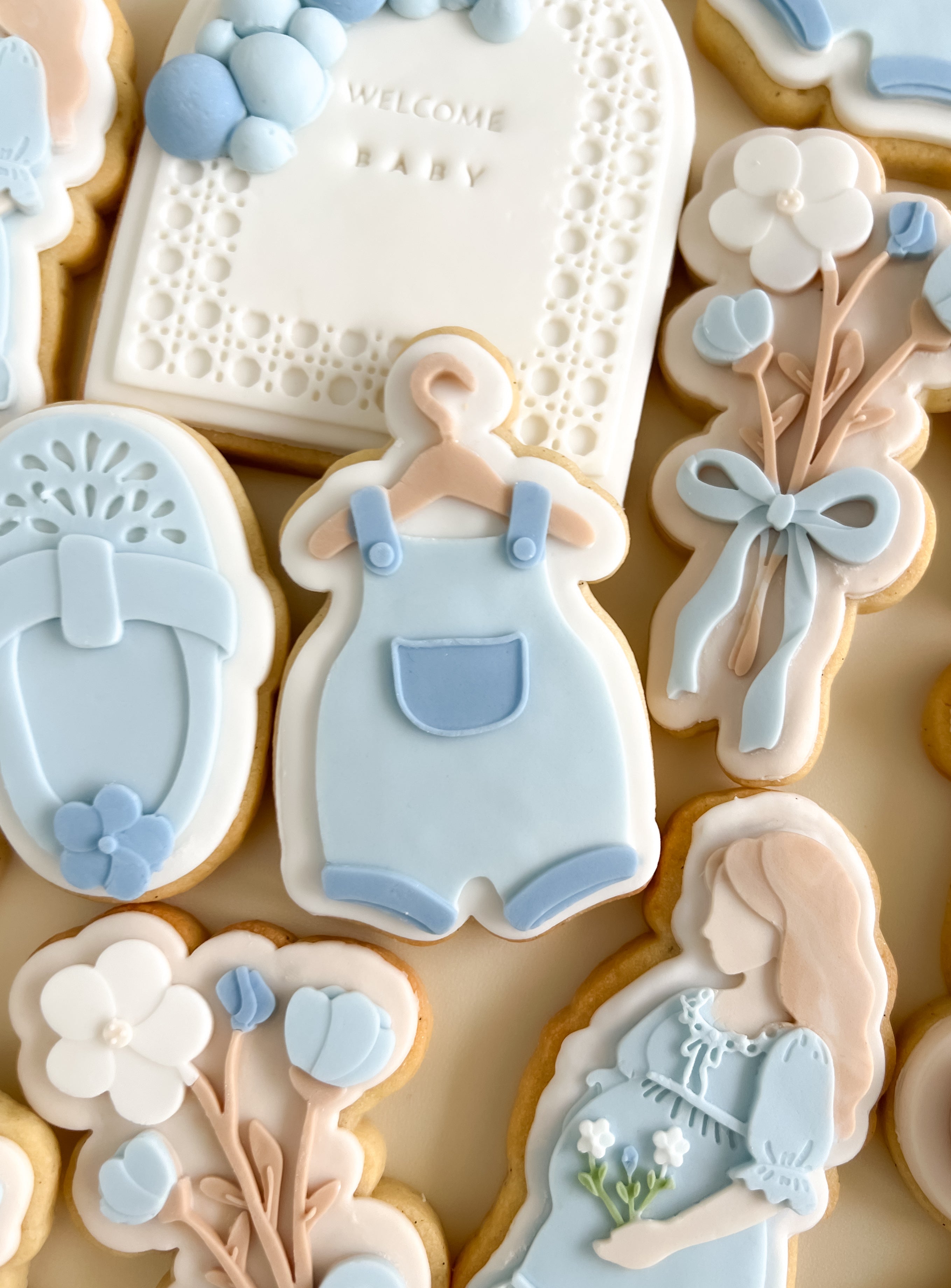 Baby overalls on coat hanger debosser and cutter