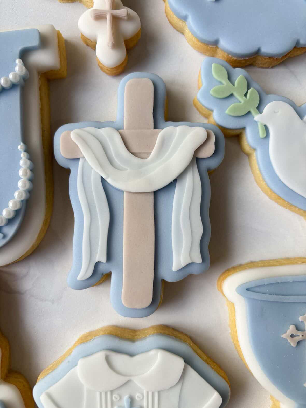 Cross with draped curtain debosser and cutter