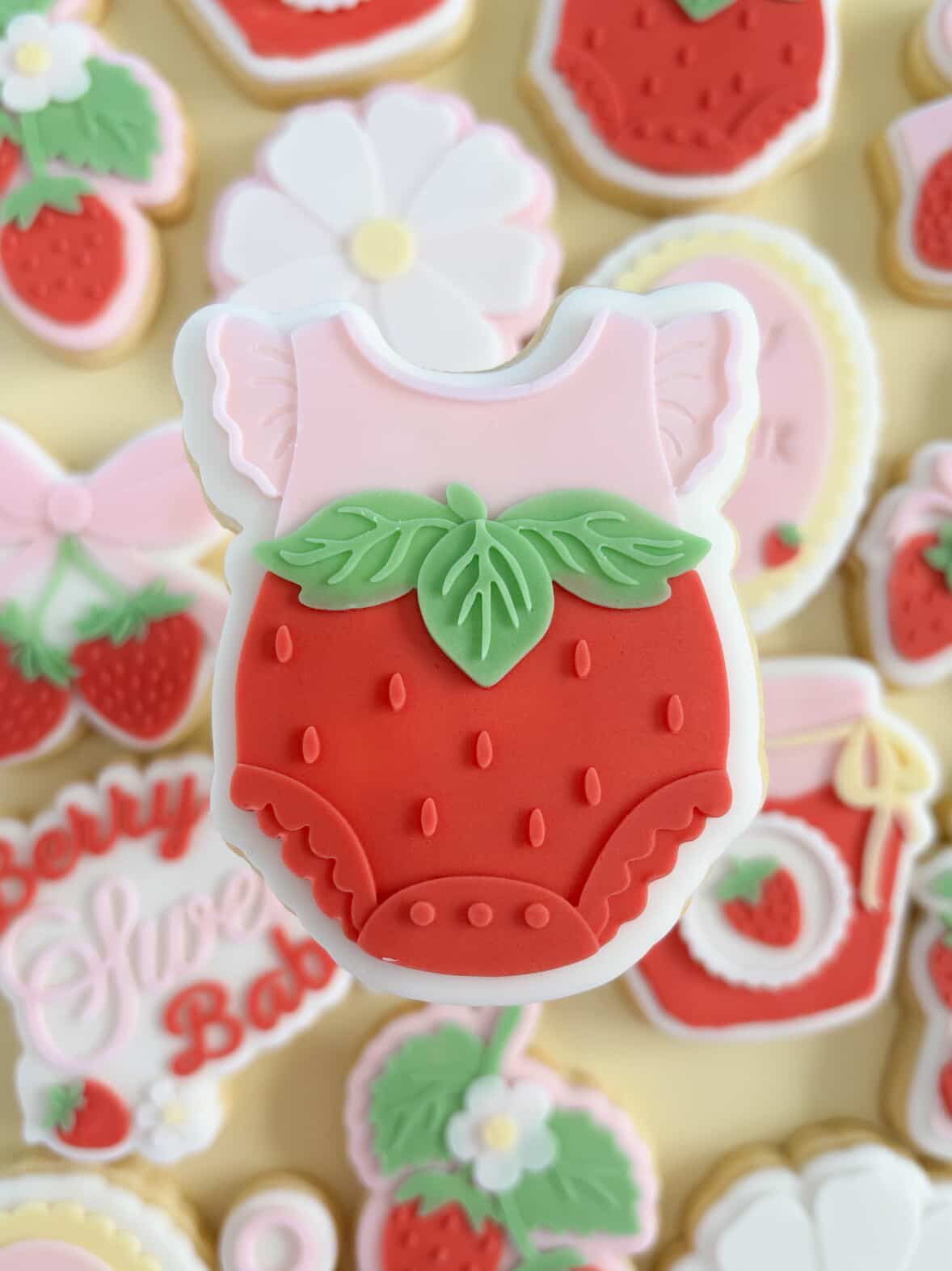 Strawberry baby onesie debosser and cutter