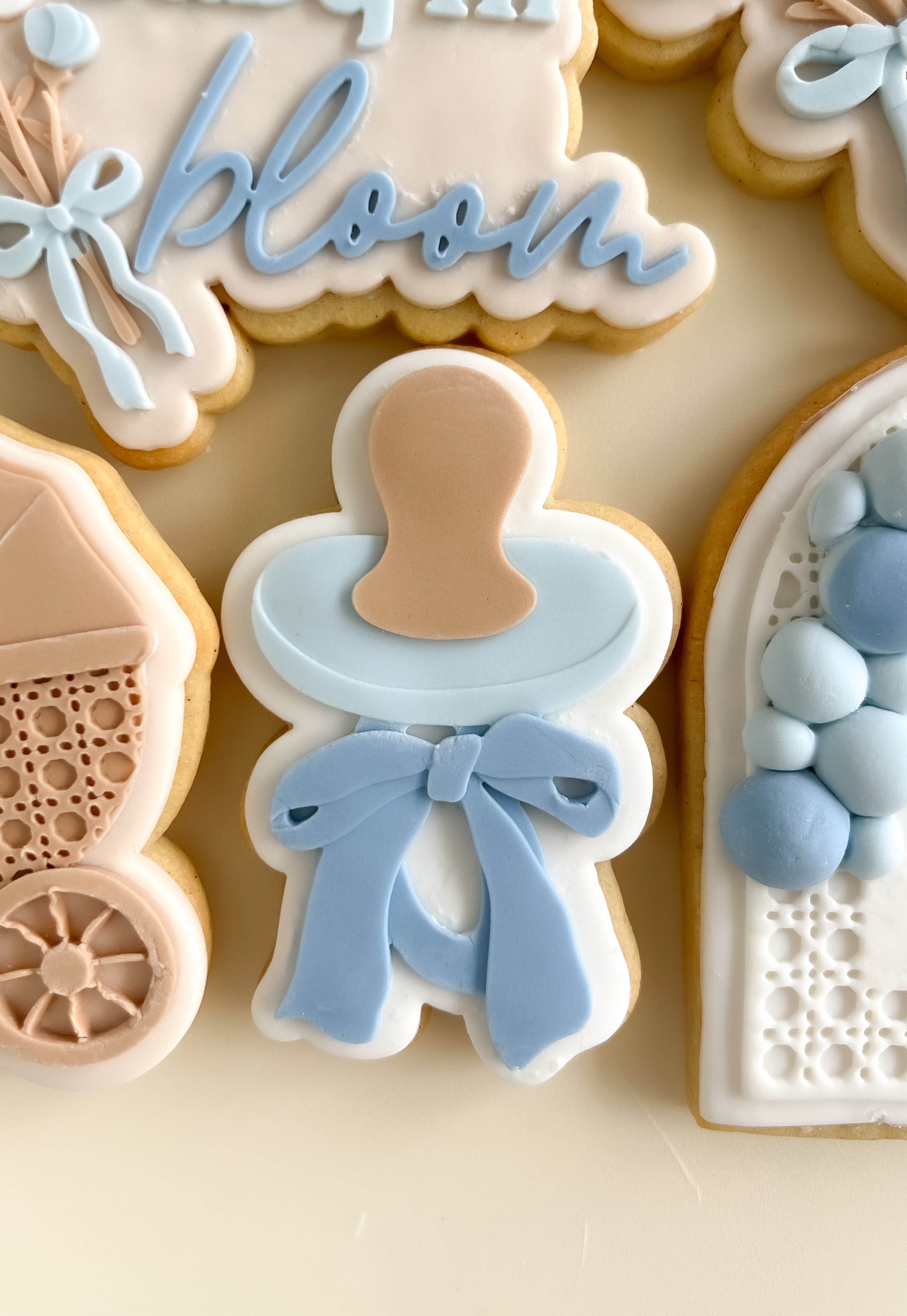 Dummy / pacifier with bow debosser and cutter