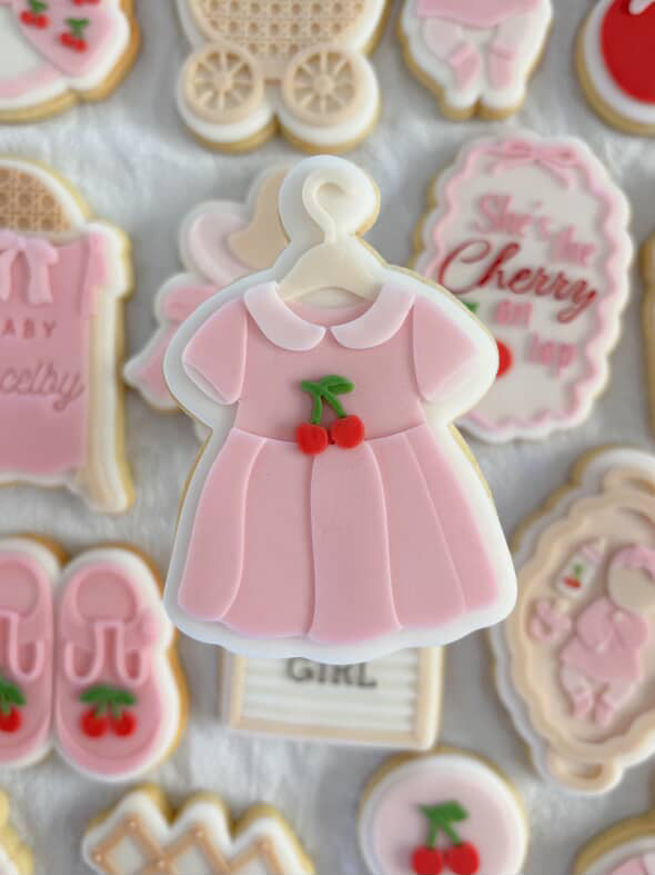 Cherry baby dress on coat hanger debosser and cutter