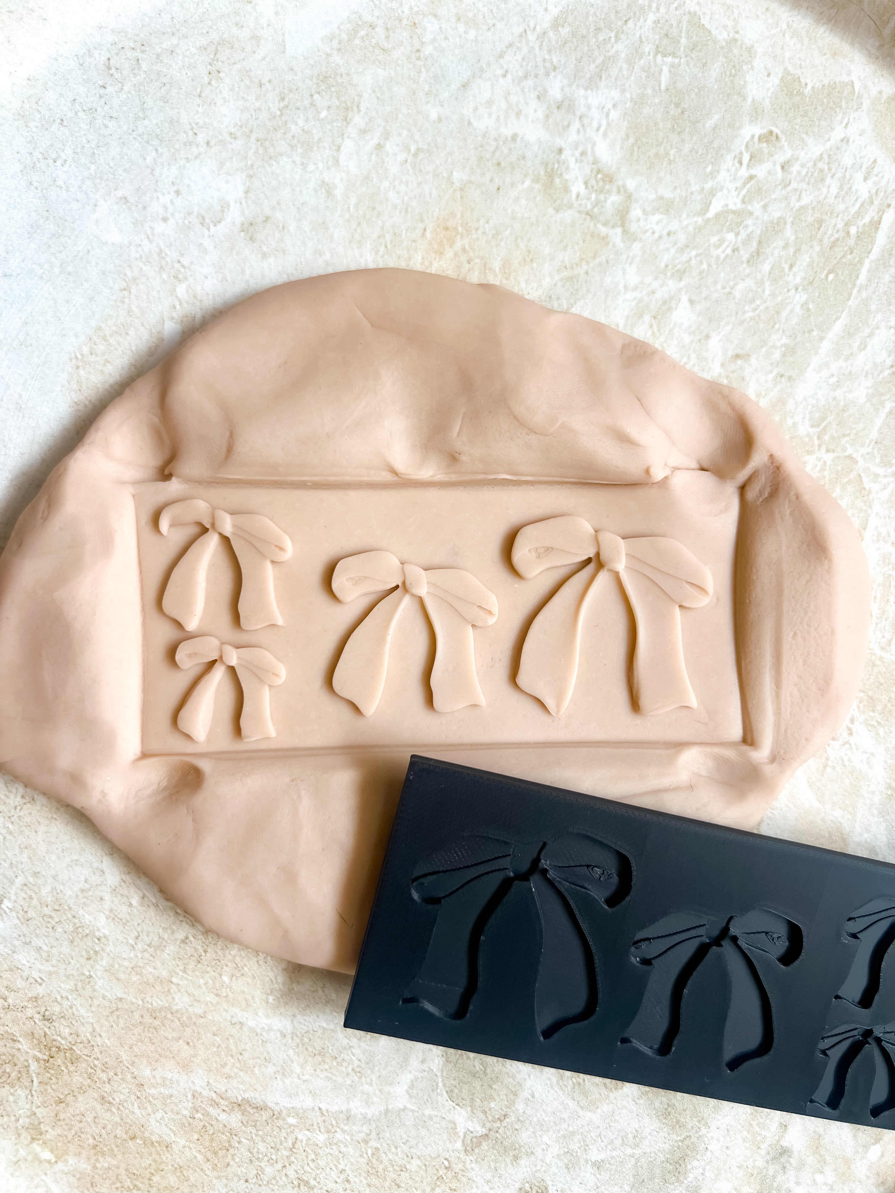 Bow plate debosser