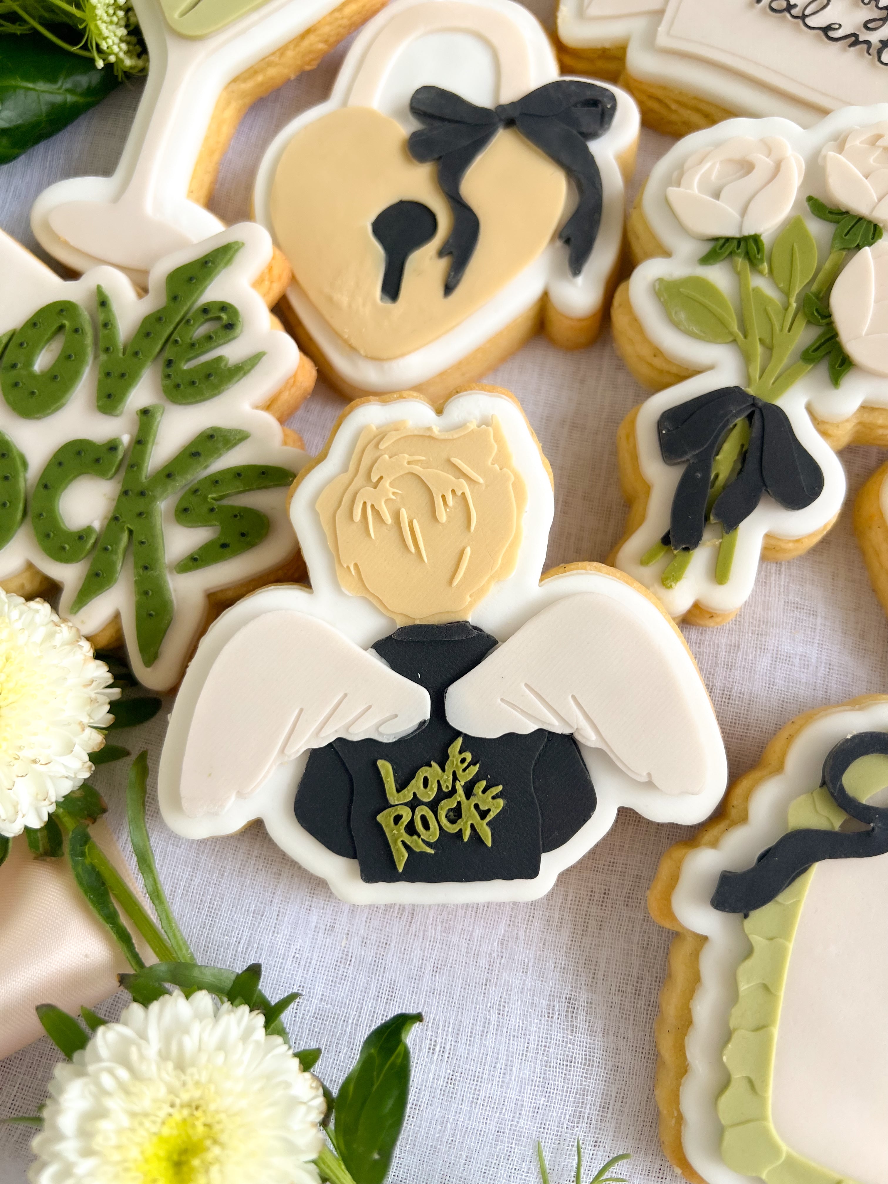 Cupid wearing “love rocks” leather jacket debosser and cutter