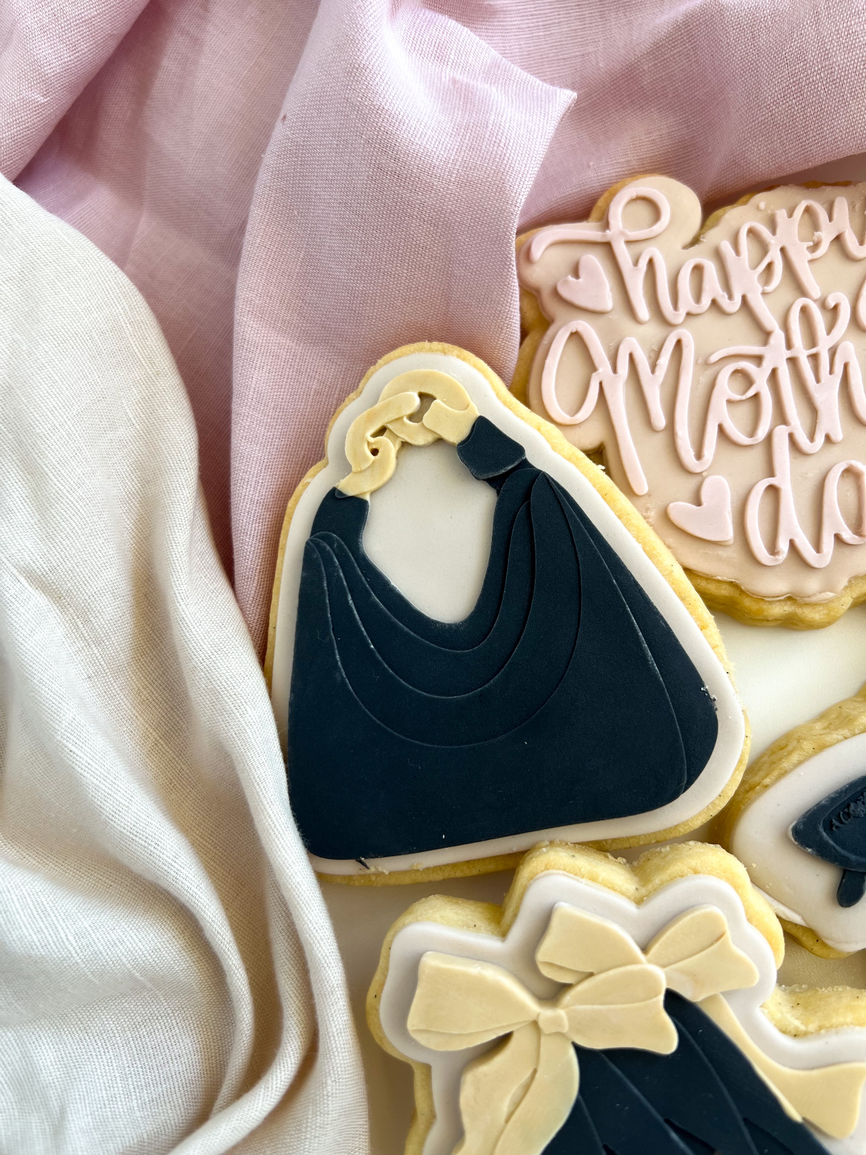 Handbag with gold chain debosser and cutter