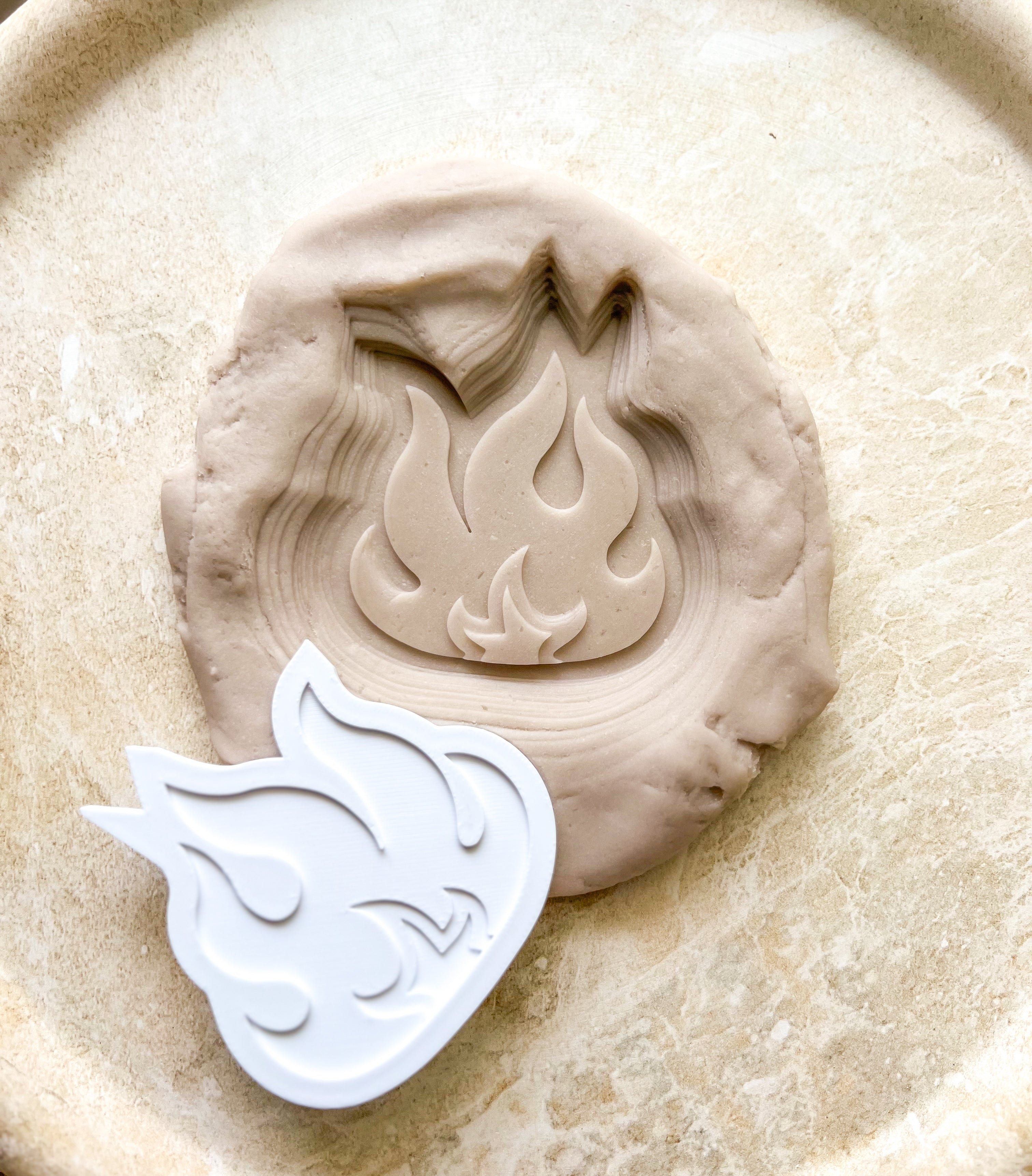 Individual flame debosser and cutter