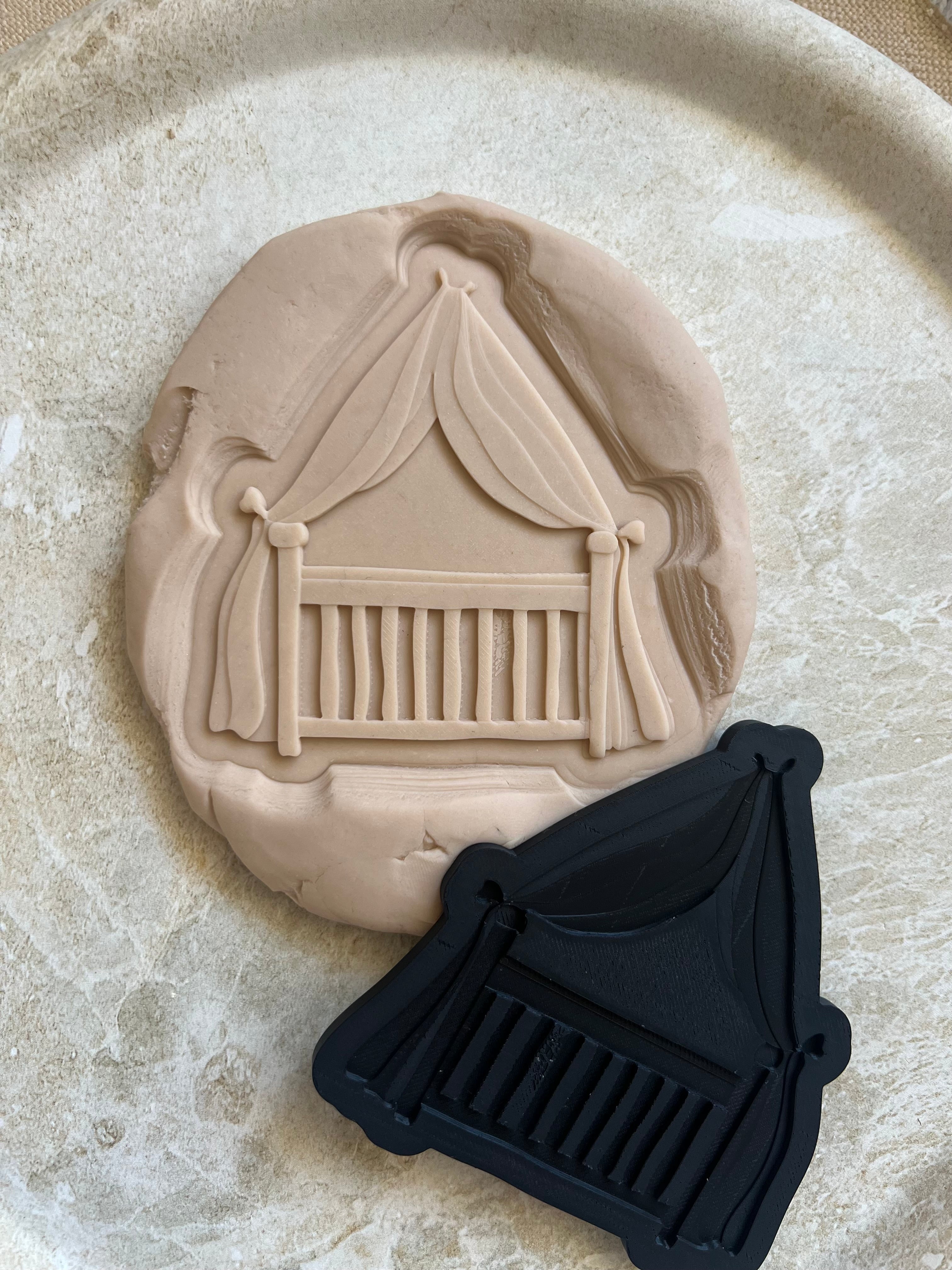 Baby cot with curtain debosser and cutter