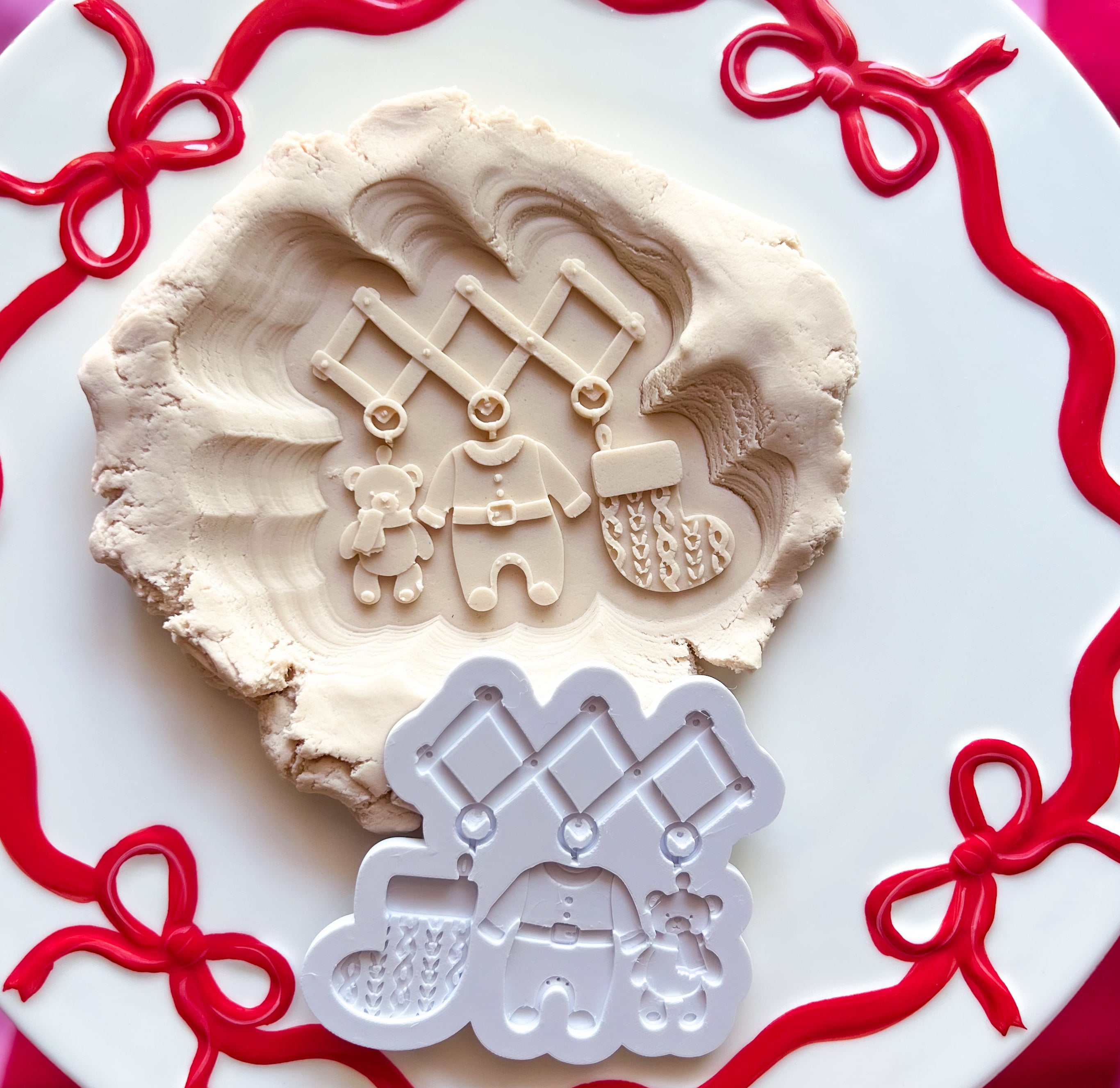 Timber frame with Christmas baby items debosser and cutter