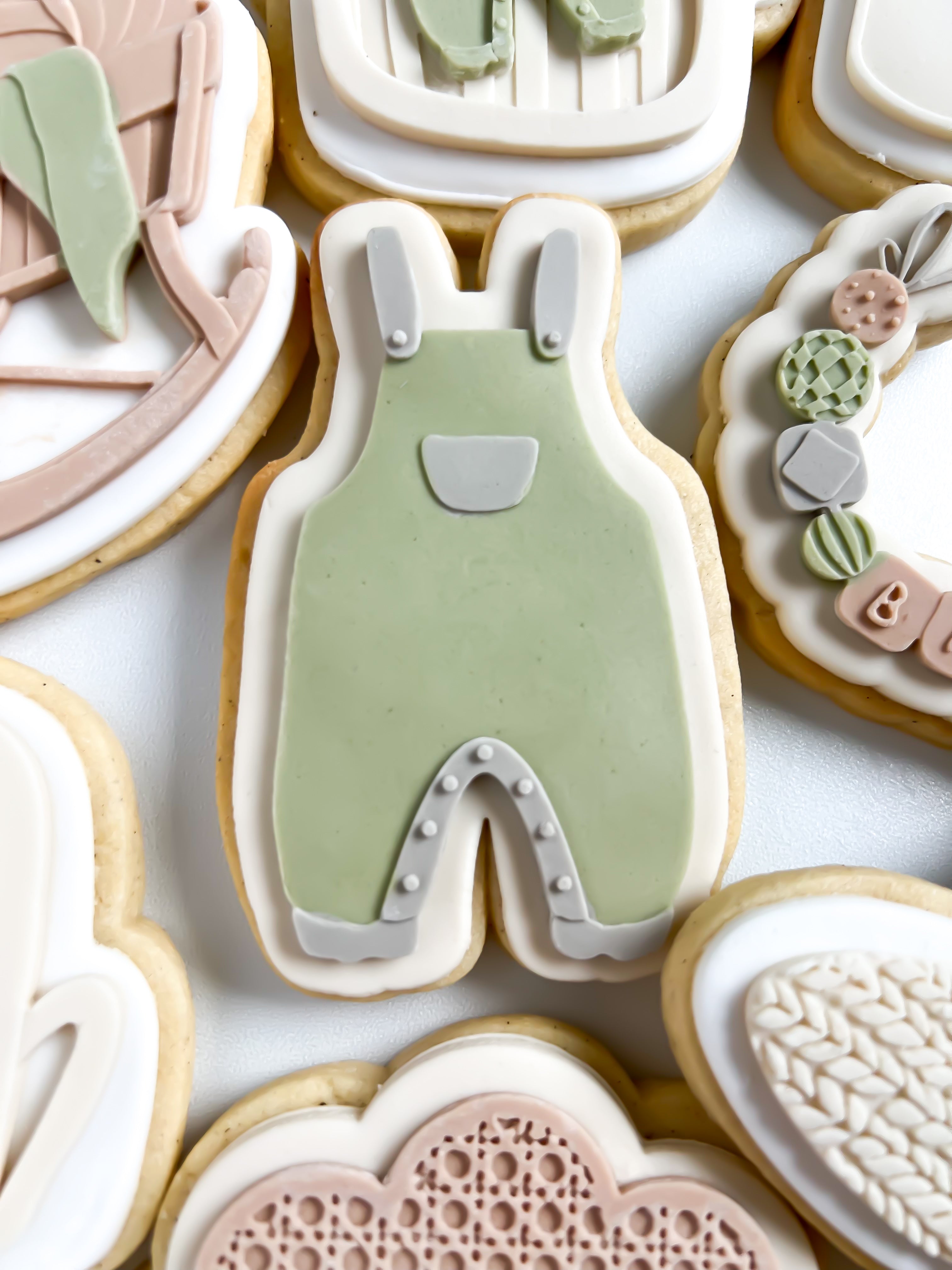 Baby onesie debosser and cutter