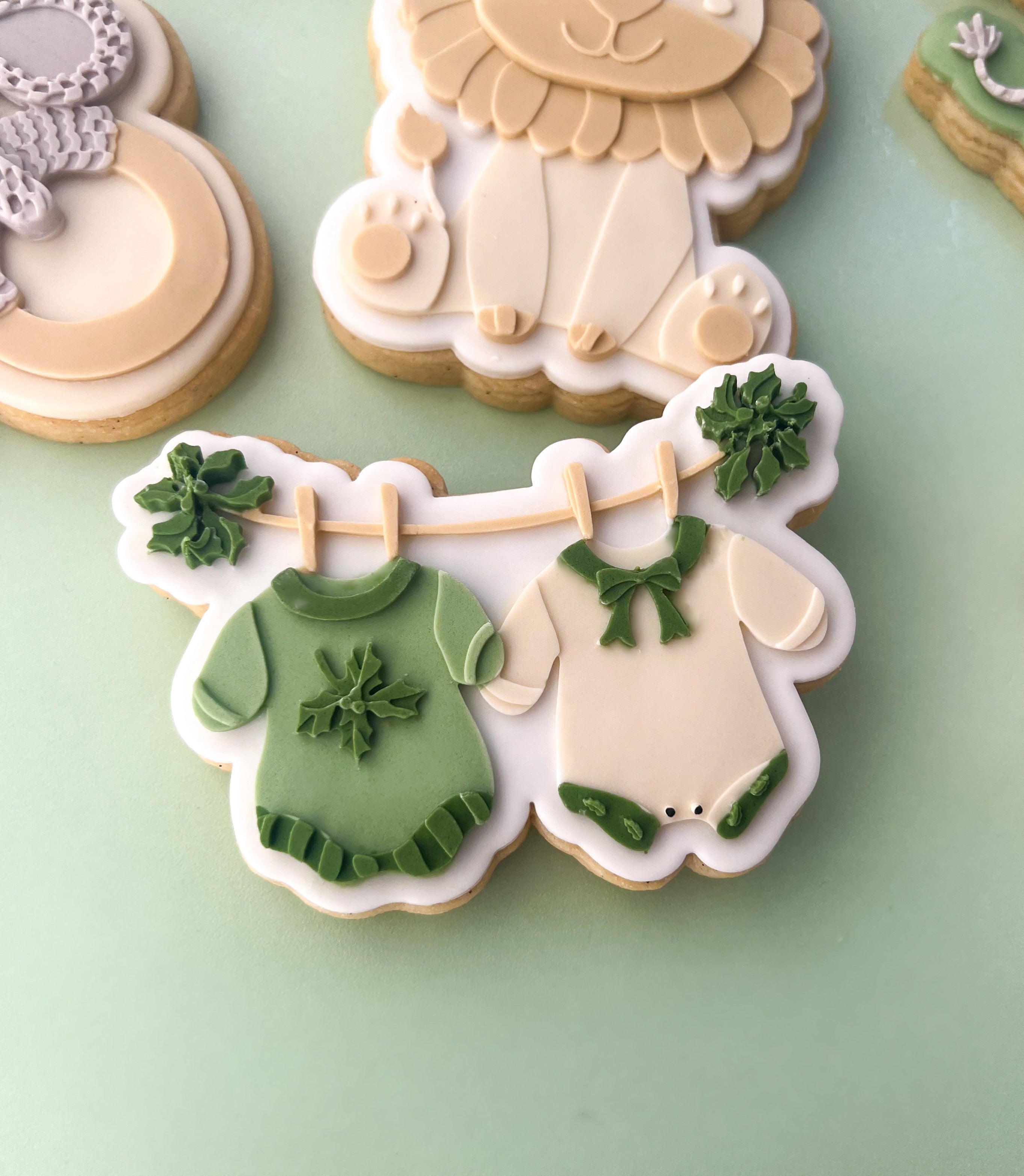 Christmas baby clothes on clothesline debosser and cutter