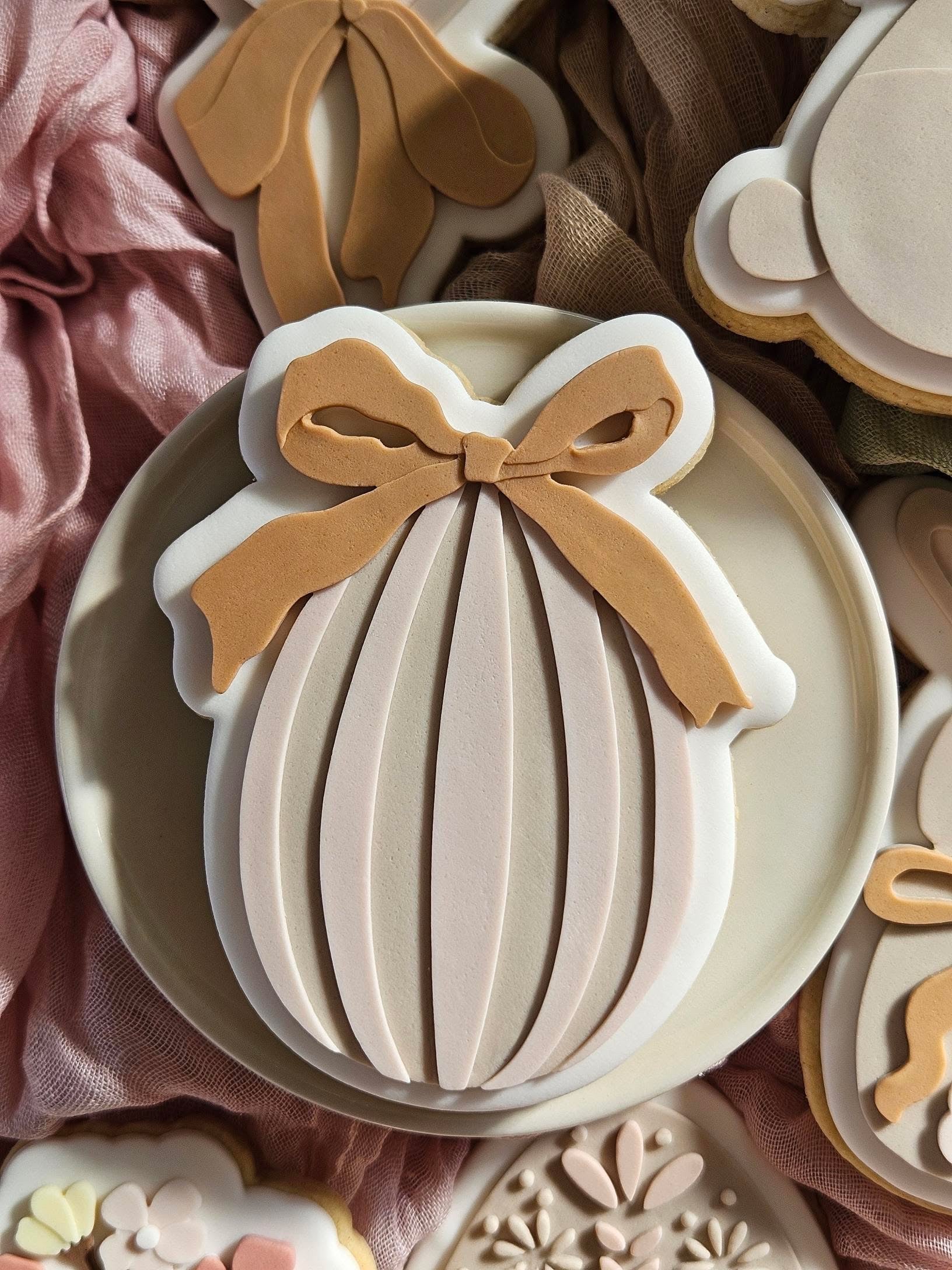Striped egg with bow debosser and cutter