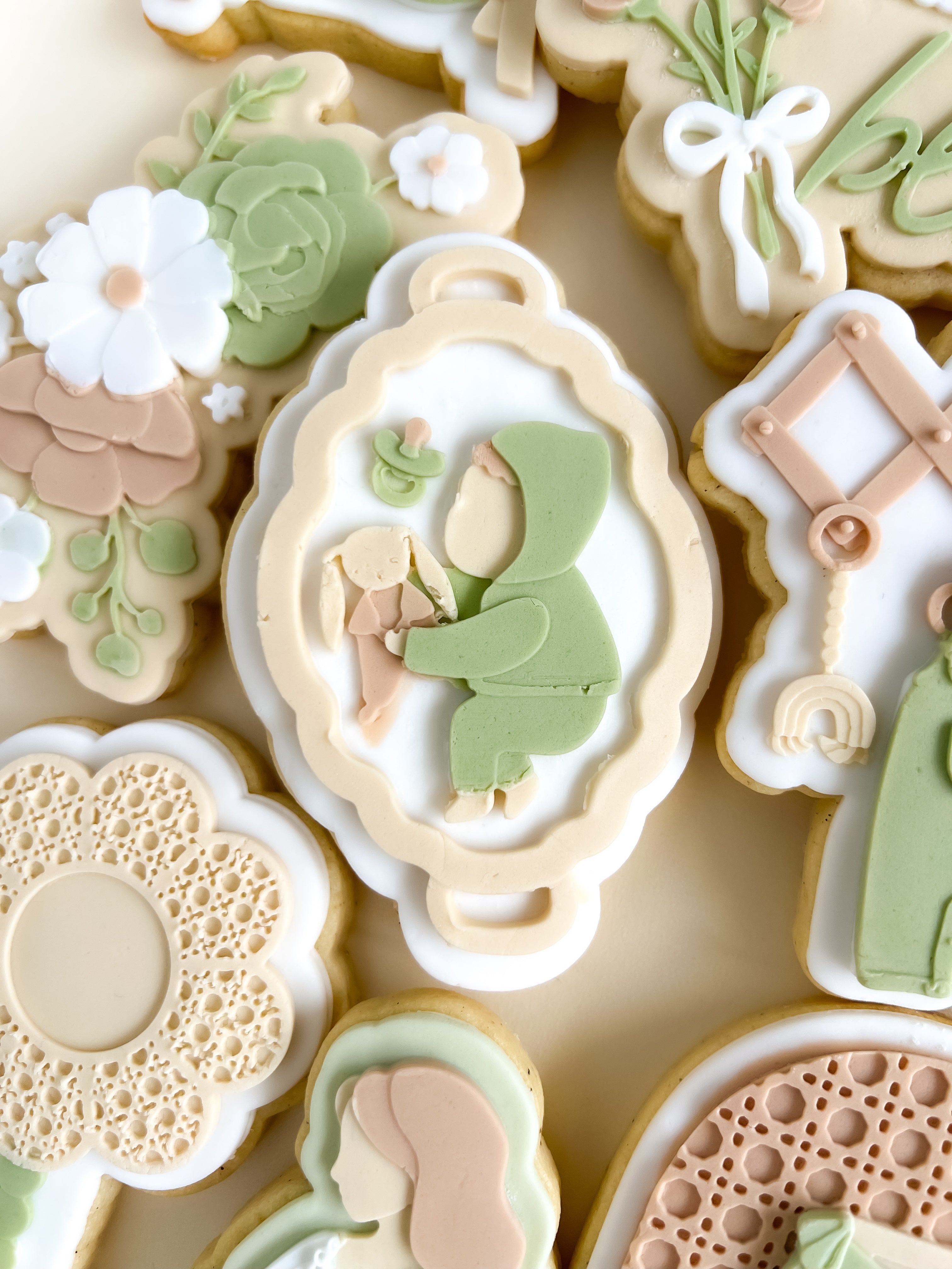 Baby and toy bunny on flat bassinet debosser and cutter