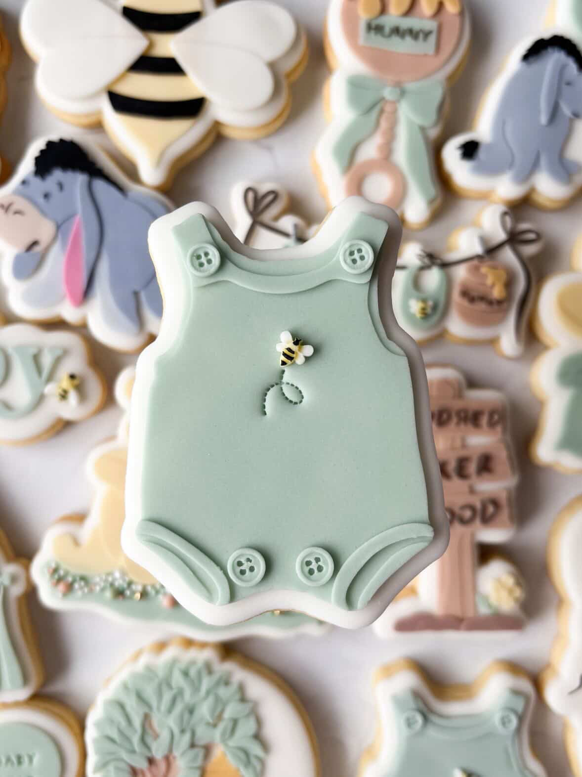 Onesie with buttons debosser and cutter