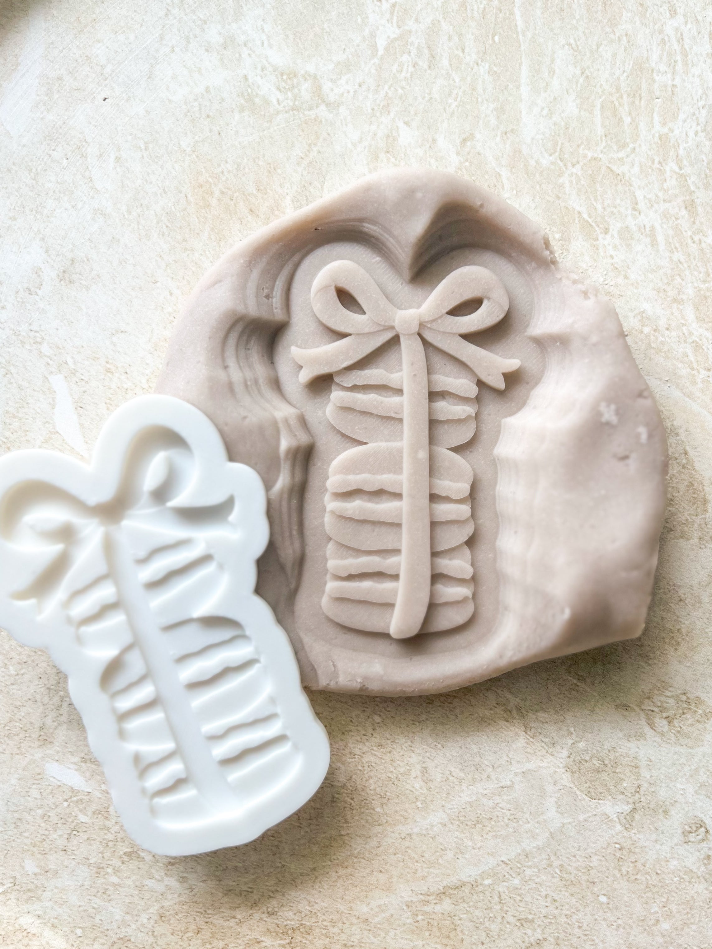 Macaroons with bow debosser and cutter